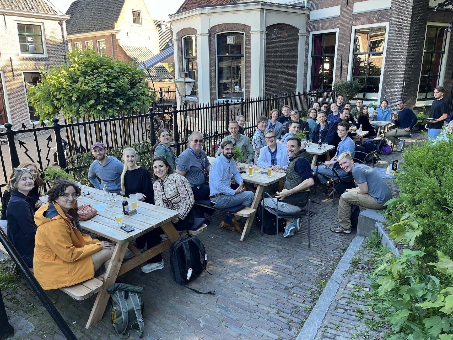 First epoch establishing what may or may not be 30 astronomers sitting in sun shaded tables in Leiden.