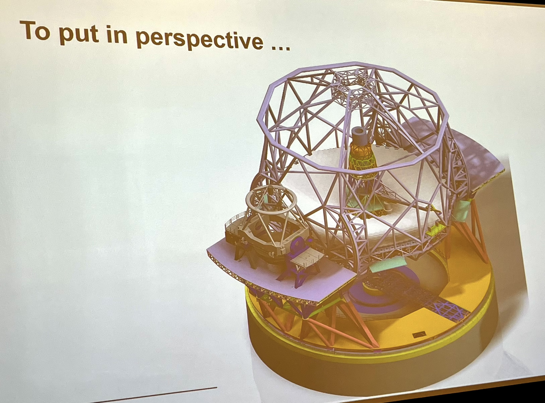A graphic of the Extremely Large Telescope with one 8.4m Very large Telescope sitting on ONE of the Nasmyth platforms!