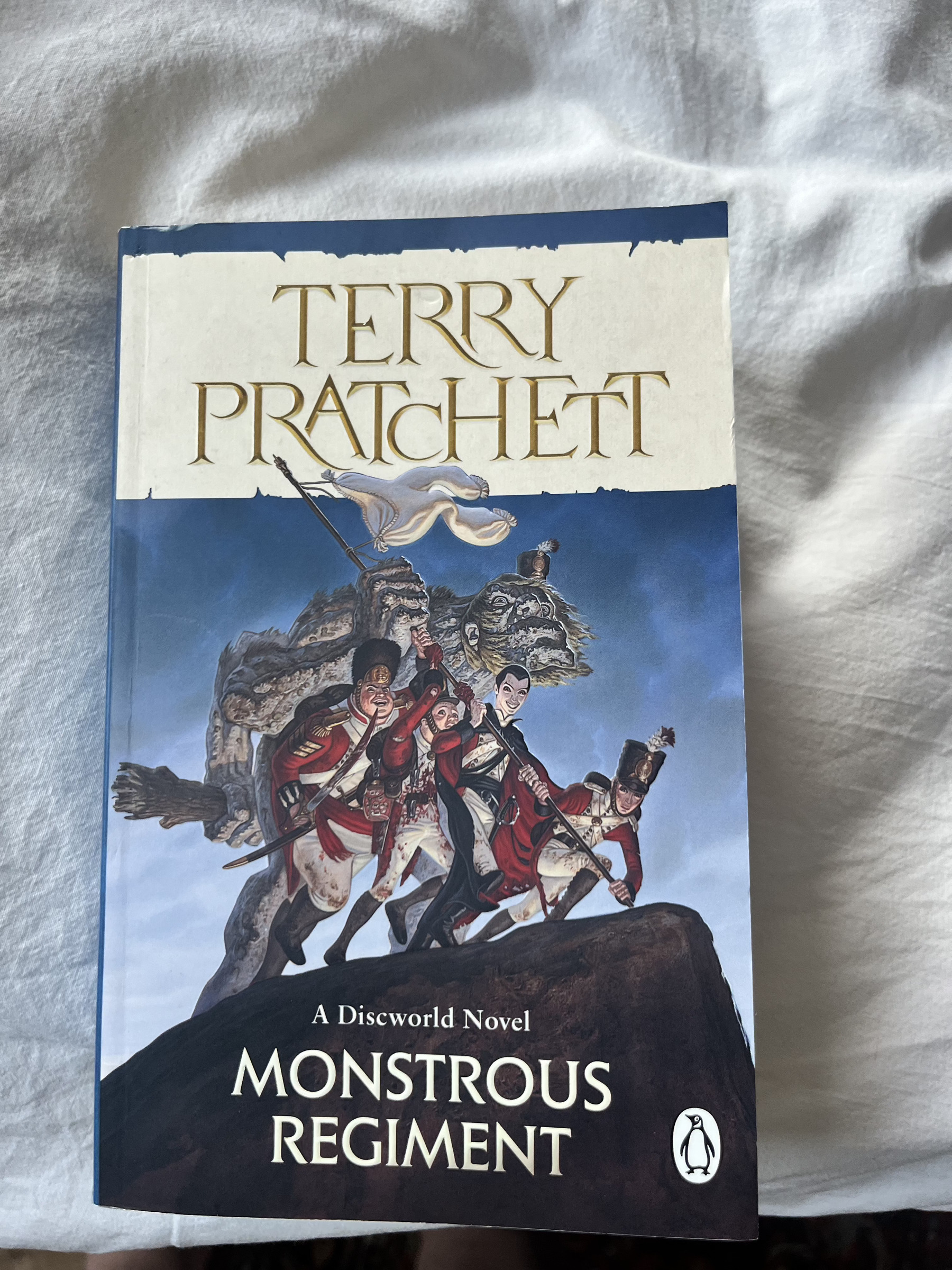 The front cover of Penguin imprint of "Monstrous Regiment" by Terry Praatchett.