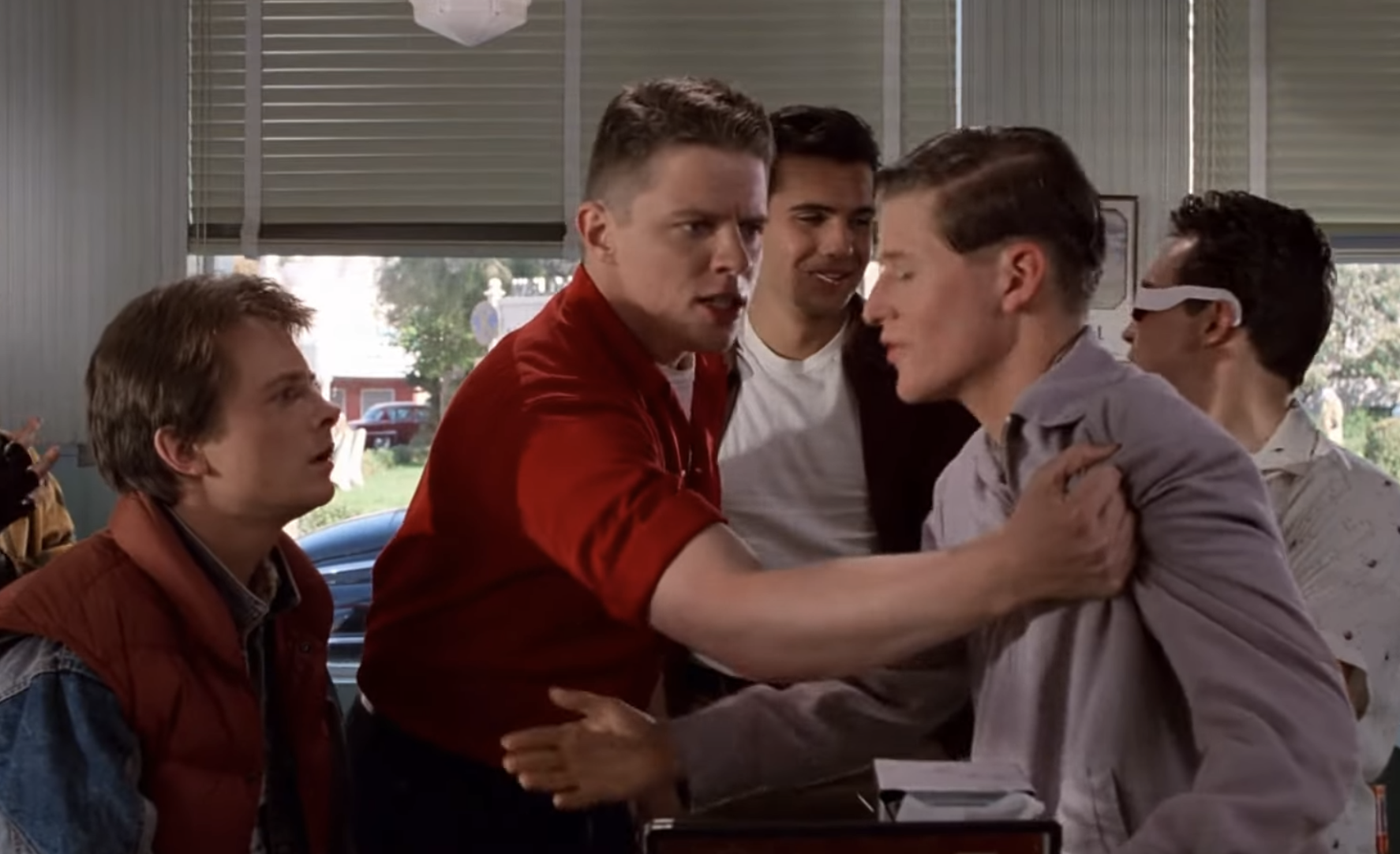 Marty watching his father getting bullied by Biff Tanner in 1955.
